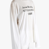 White t-shirt worn by a person, showing the t-shirt fit