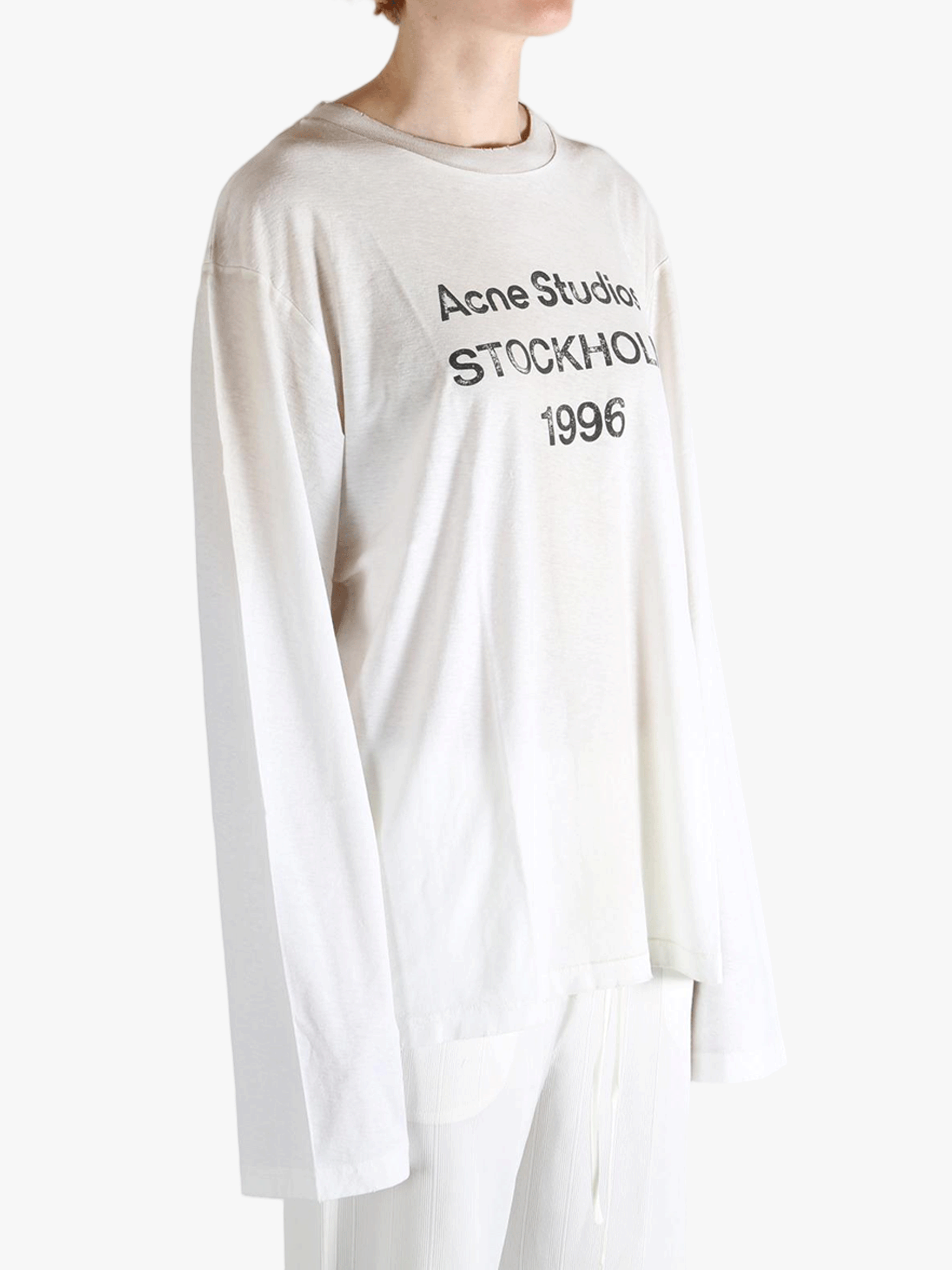 White t-shirt worn by a person, showing the t-shirt fit