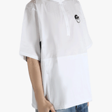 white t-shirts worn by a person, showing the t-shirts fit