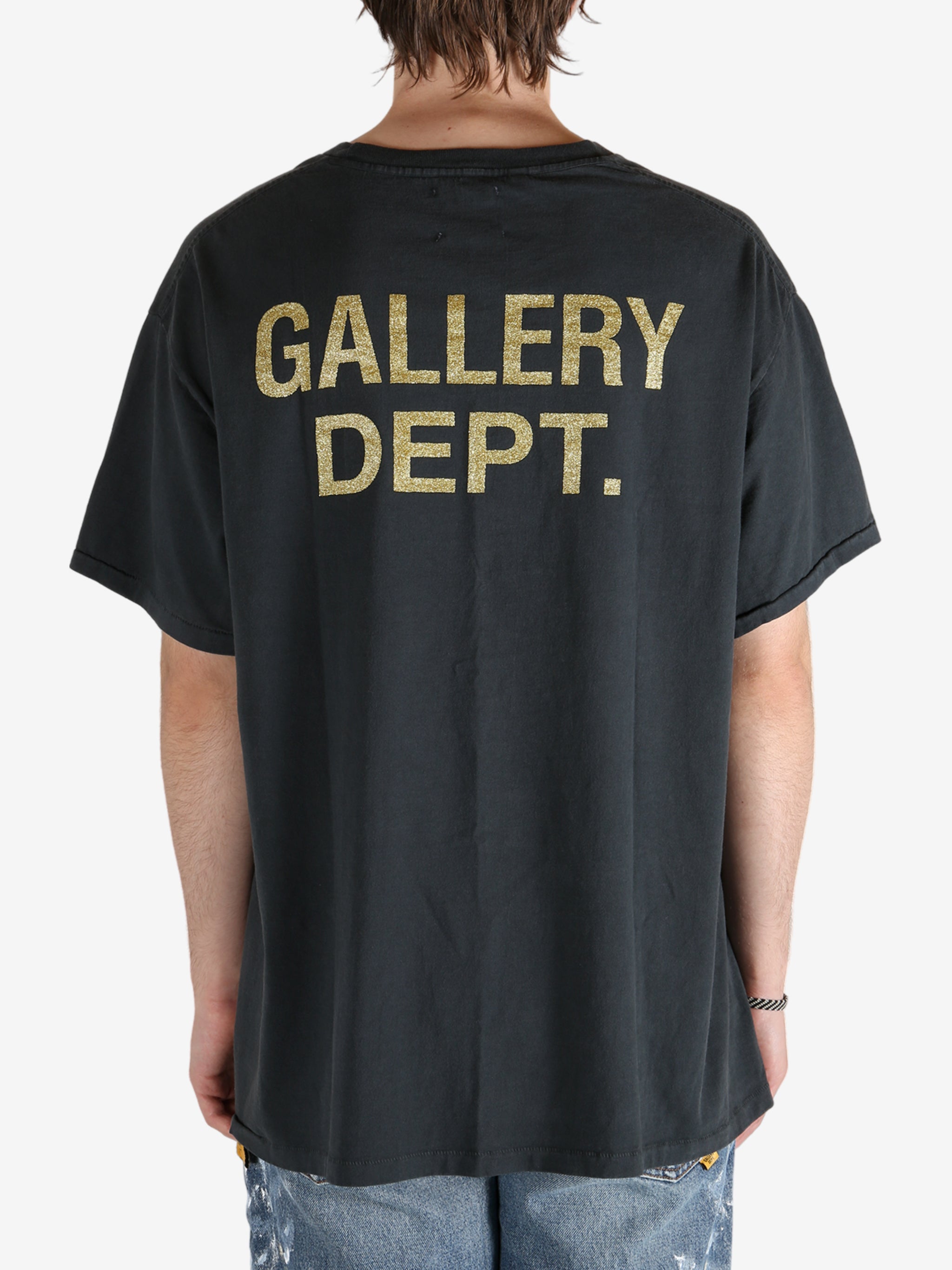 Black t-shirt worn by a person, showing the t-shirt's fit