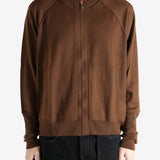 Brown cardigan worn by a person, showing the cardigan's fit