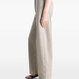 Grey pant worn by a person, showing the pant's fit