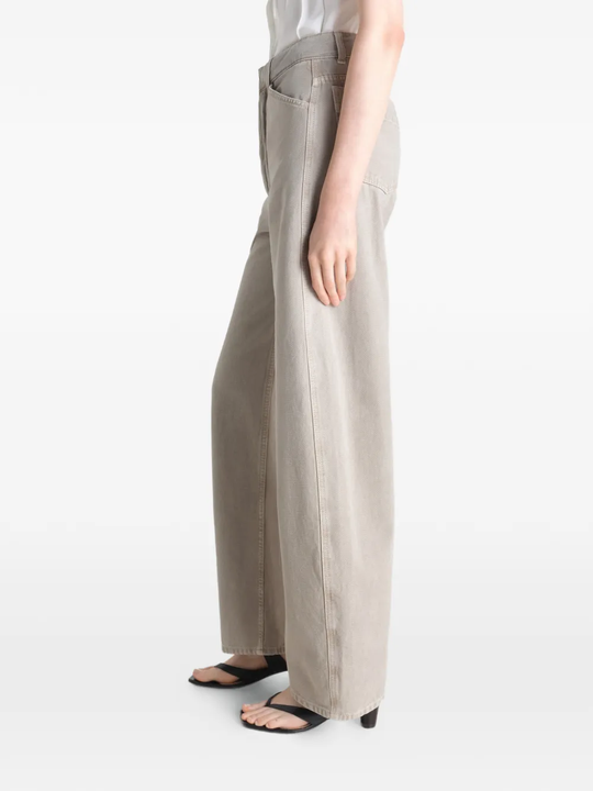 Grey pant worn by a person, showing the pant's fit