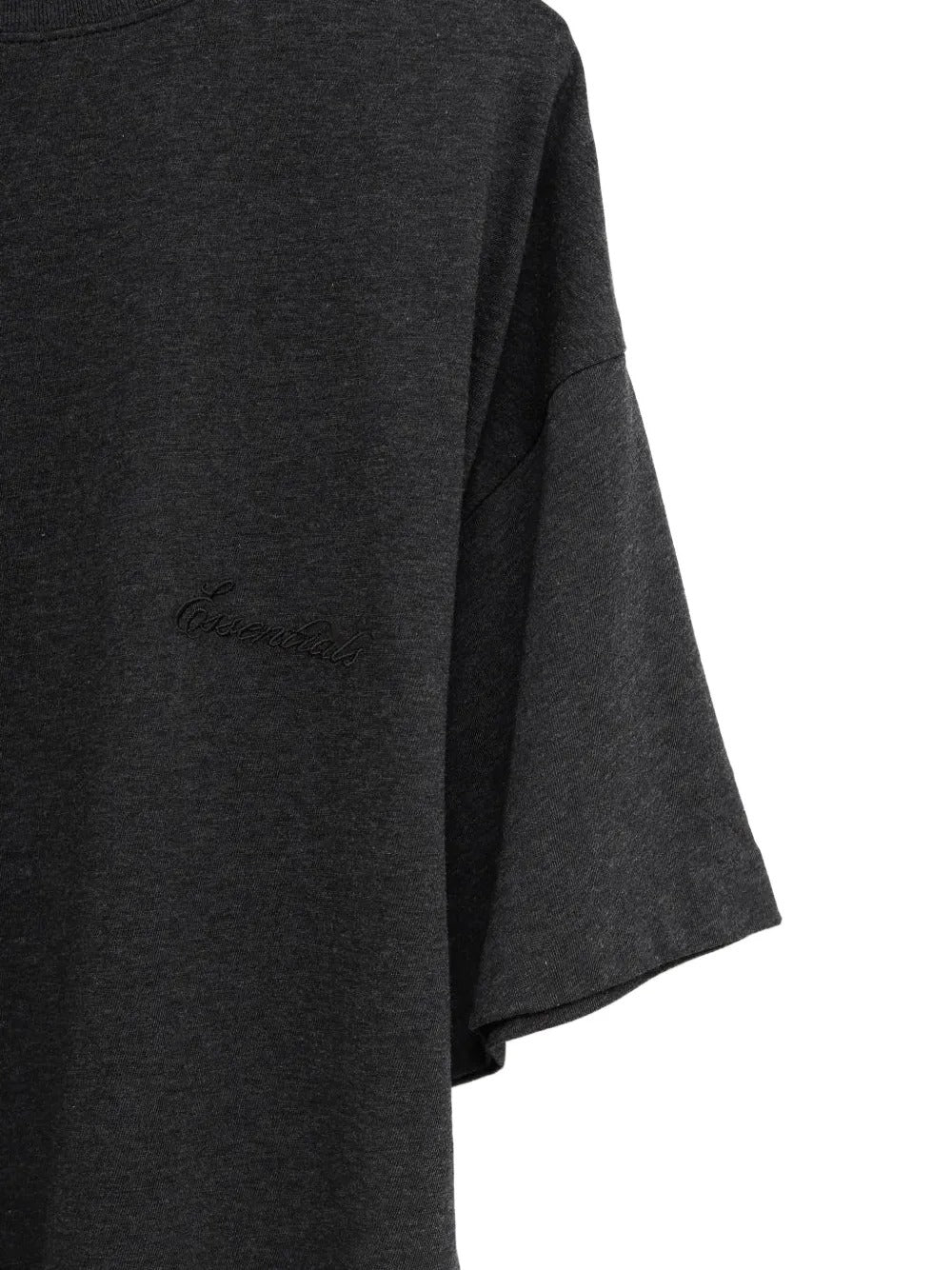 Close up of the black t-shirt, showing texture of the cotton fabric