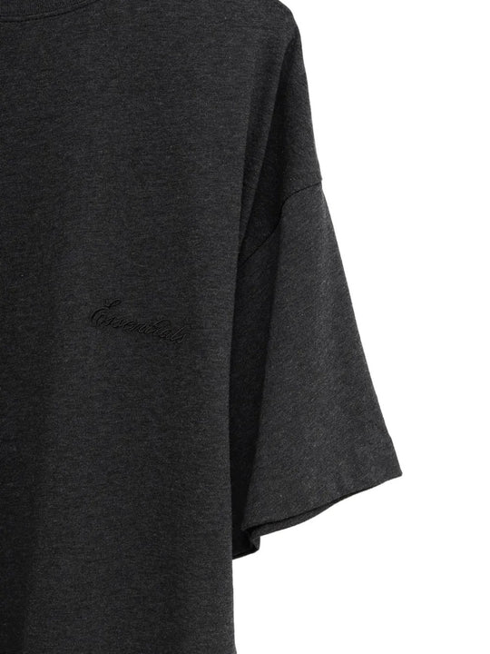 Close up of the black t-shirt, showing texture of the cotton fabric