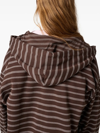 Close up of the brown hoodie, showing texture of the cotton fabric