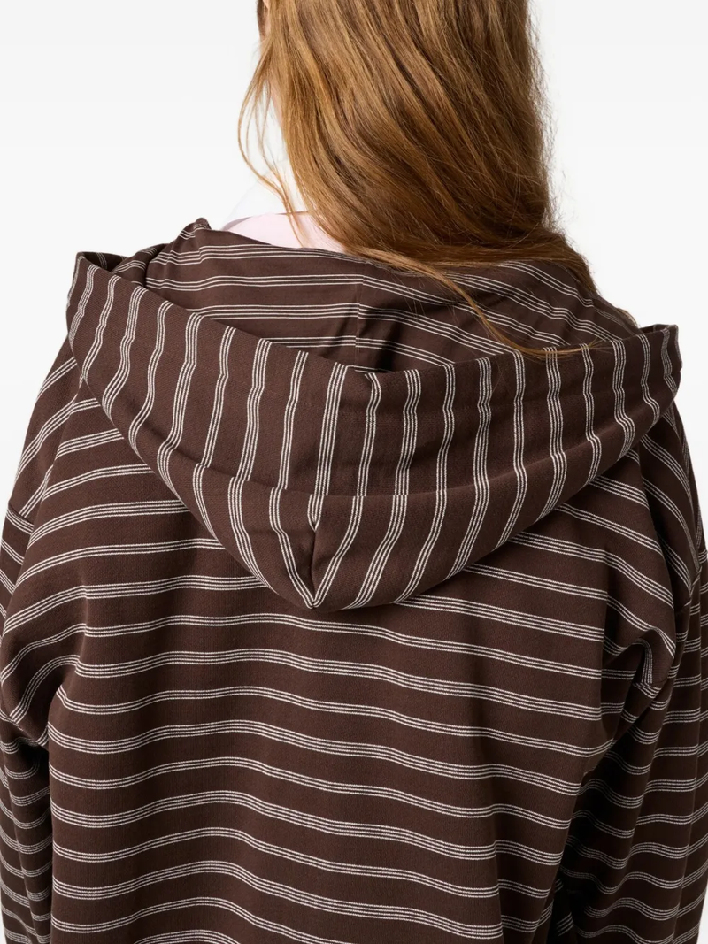 Close up of the brown hoodie, showing texture of the cotton fabric