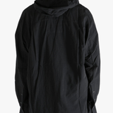 Black shirt worn by a person, showing the shirt's fit