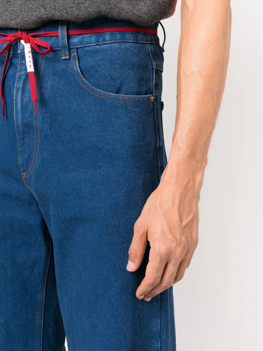 Close up of blue jeans, showing texture of the calf leather fabric