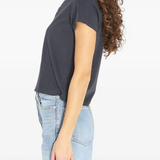 black t-shirt worn by a person, showing the t-shirt fit