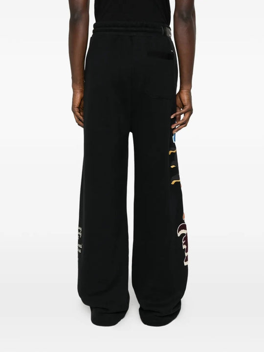 Black pant worn by a person, showing the pant's fit