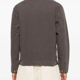 Brown jacket worn by a person, showing the jacket's fit