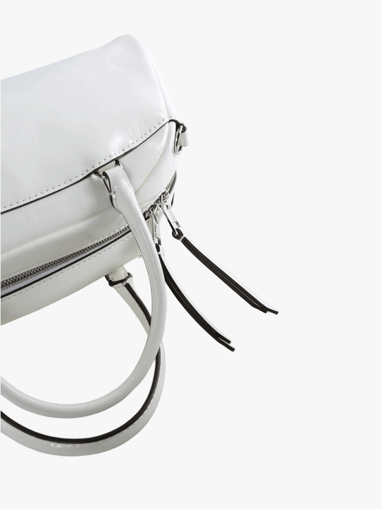 Close up of white bag, showing the detial of the zip