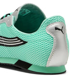 Close-up of green sneaker, showing texture of the mesh fabirc