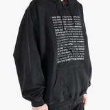 Black hoodie worn by a person, showing the hoodie fit