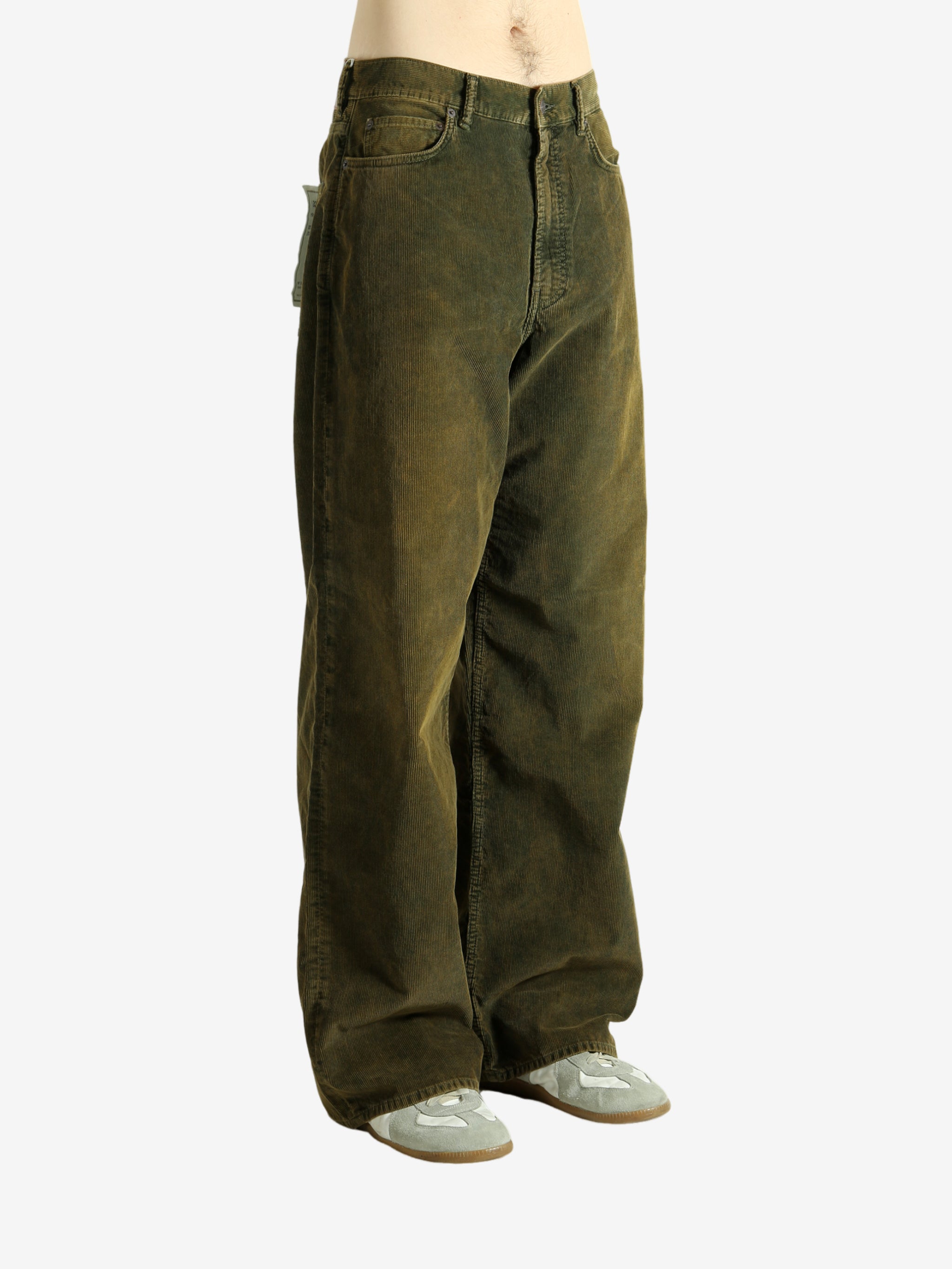 Green pant worn by a person, showing the pant's fit