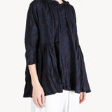 Navy shirt worn by a person, showing the shirt fit