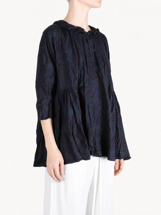 Navy shirt worn by a person, showing the shirt fit
