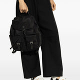 Black bag carried by a person, showing the bag’s fit