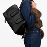 Black bag worn by a person, showing the bag fit