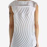 White shirt worn by a person, showing the shirt's fit