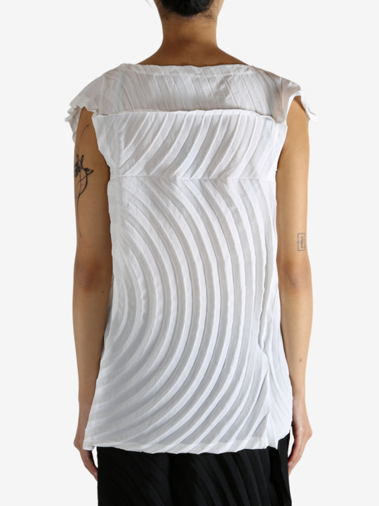 White shirt worn by a person, showing the shirt's fit