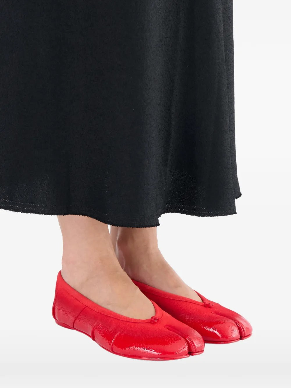 Red flat worn by a person, showing the flats' fit
