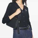 Black bag worn by a person, showing the bag's fit