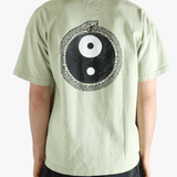 Green t-shirt worn by a person, showing the t-shirt's fit