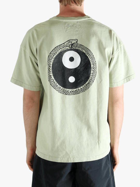 Green t-shirt worn by a person, showing the t-shirt's fit