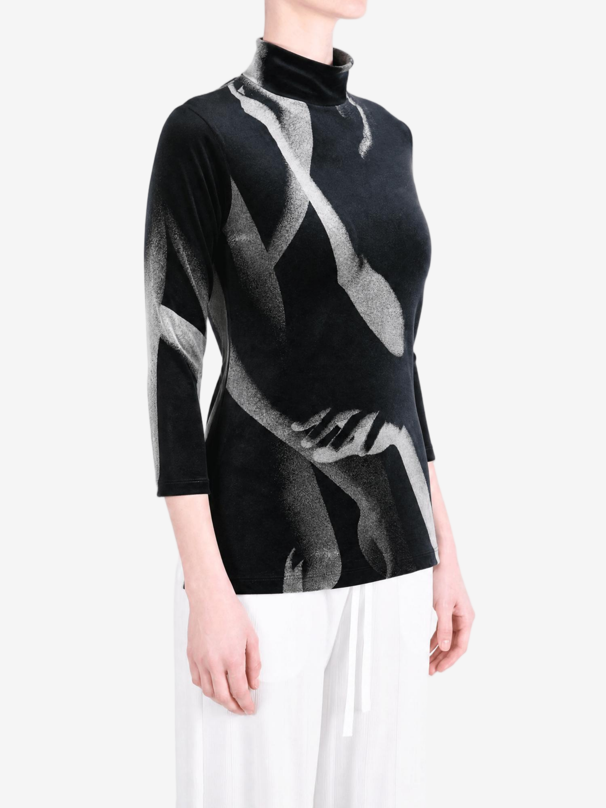 Black shirt worn by a person, showing the shirt fit