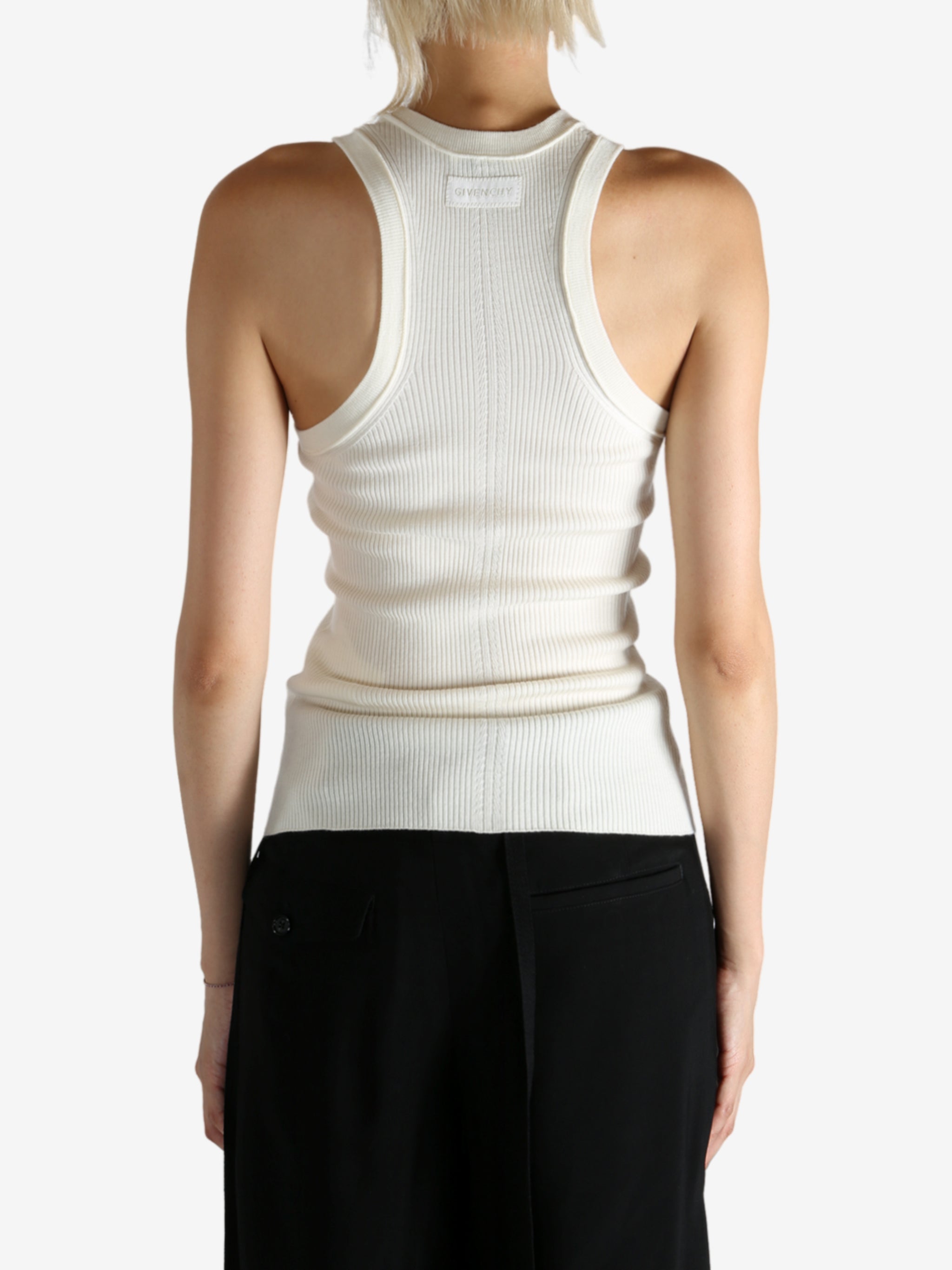 Tan top worn by a person, showing the top fit