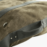 Close up of green bag, showing the texture of the leather