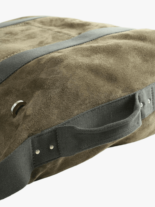 Close up of green bag, showing the texture of the leather