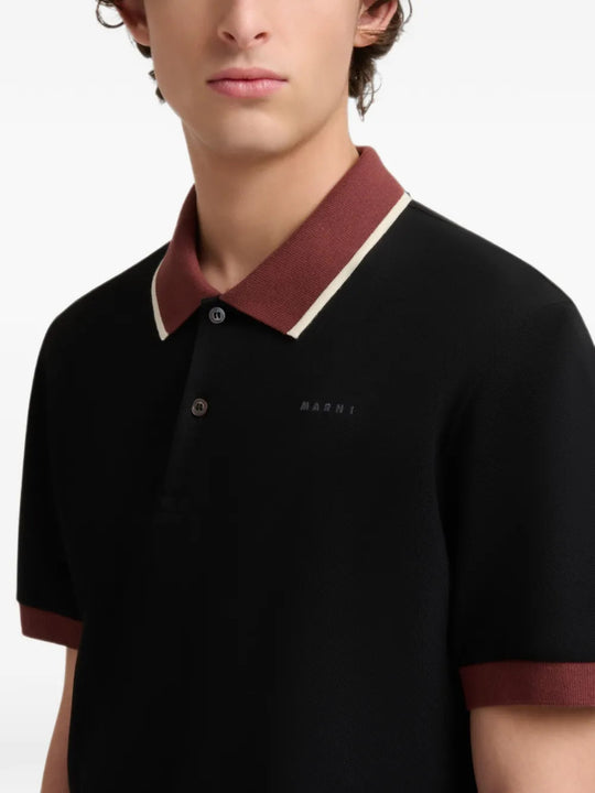 Black t-shirt worn by a person, showing the t-shirt fit