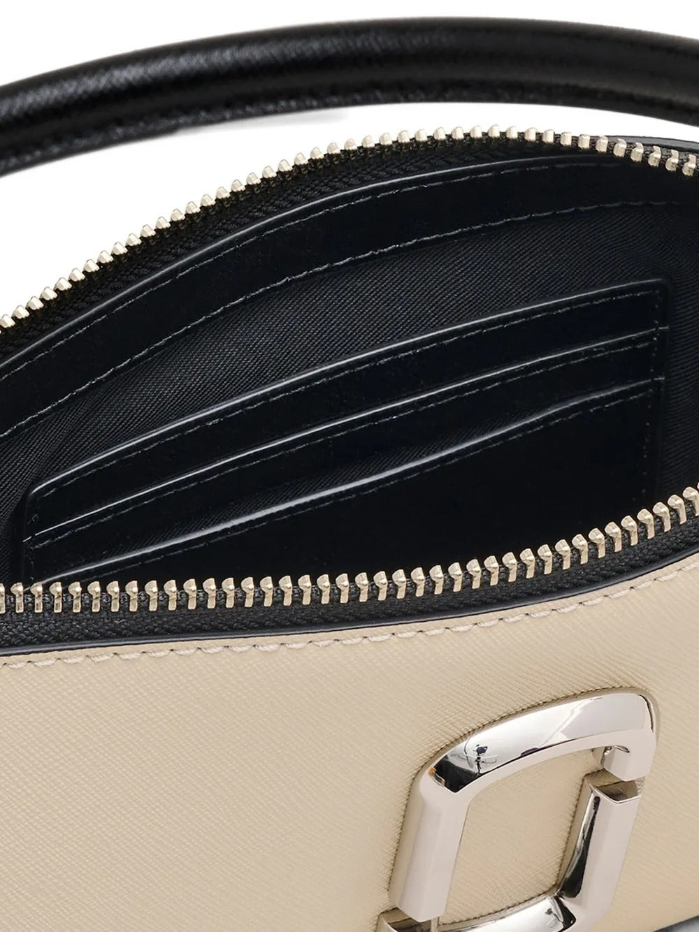 Close up of tan bag, showing texture of the leather fabric