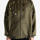 Green sweat worn by a person, showing the sweat fit