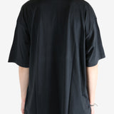 Black shirt worn by a person, showing the shirt fit