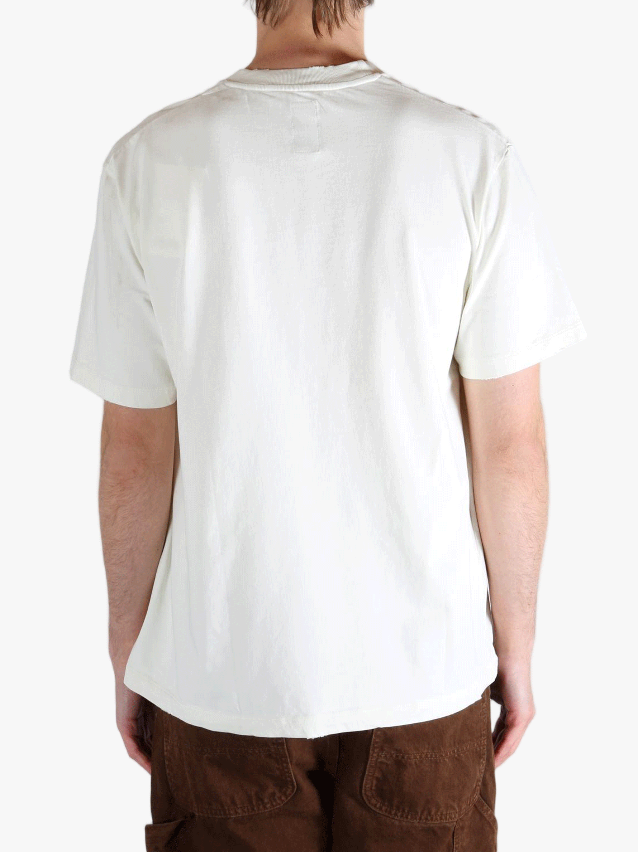 White t-shirt worn by a person, showing the t-shirt's fit