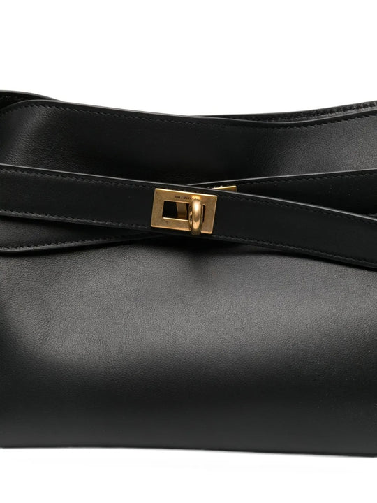 Close up of black bags, showing texture of the calf leather fabric
