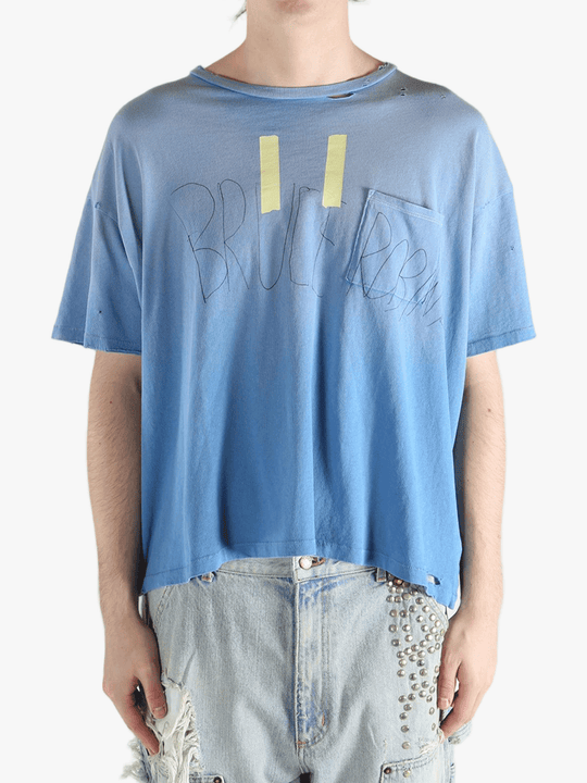 Blue t-shirt worn by a person, showing the shirt's fit