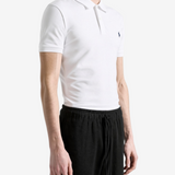 White shirt worn by a person, showing the shirt fit