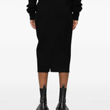 Black skirt worn by a person, showing the skirt's fit