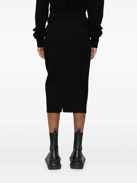 Black skirt worn by a person, showing the skirt's fit