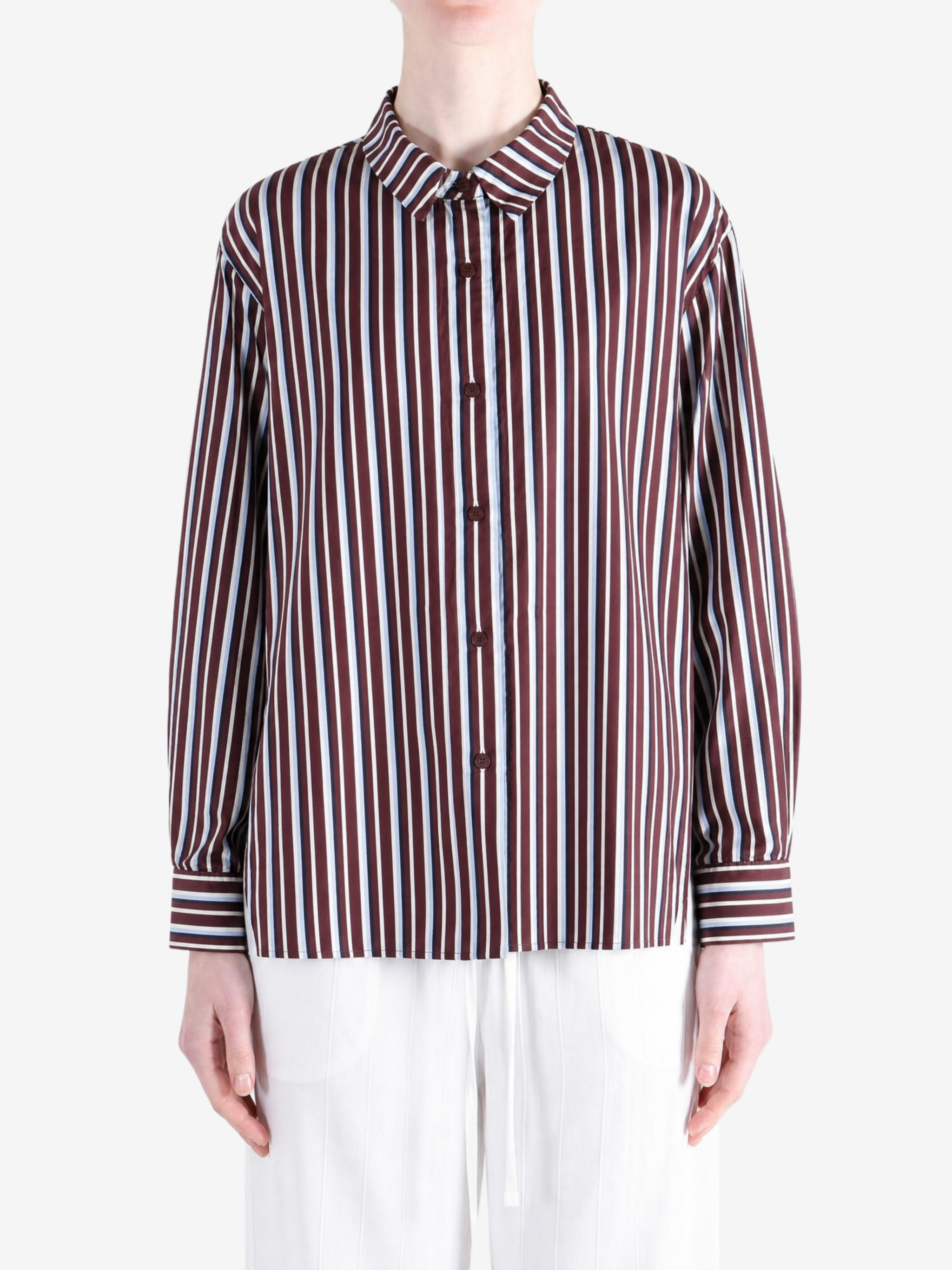 Burgundy shirt worn by a person, showing the shirt fit
