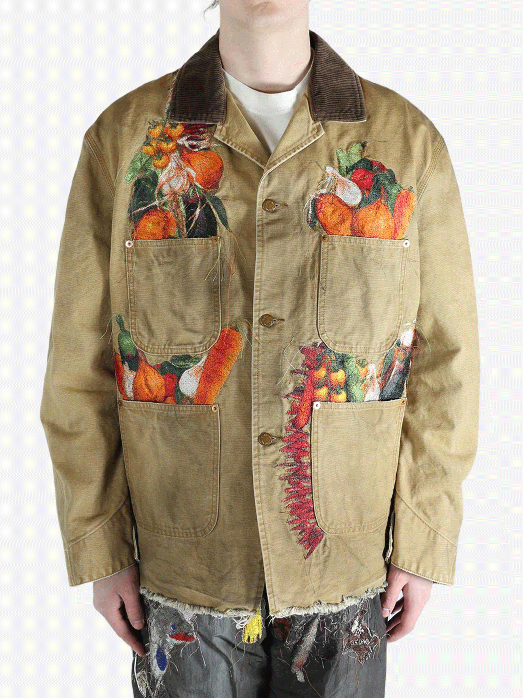 Tan jacket worn by a person, showing the jacket's fit