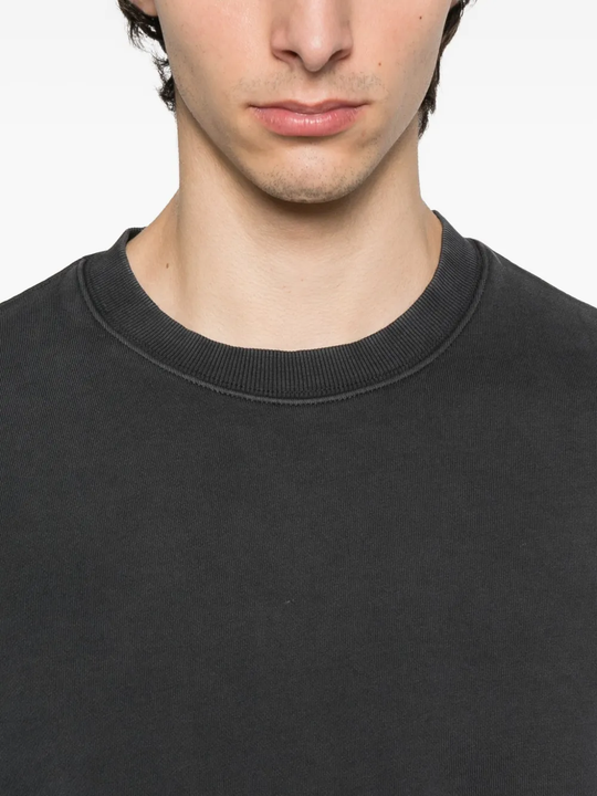 Close up of the black sweat, showing texture of the cotton fabric