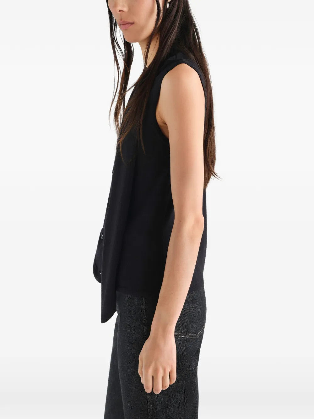 Black top worn by a person, showing the top fit