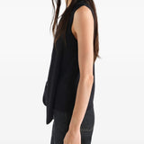 Black top worn by a person, showing the top fit