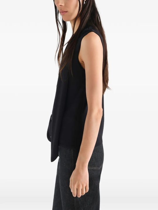 Black top worn by a person, showing the top fit